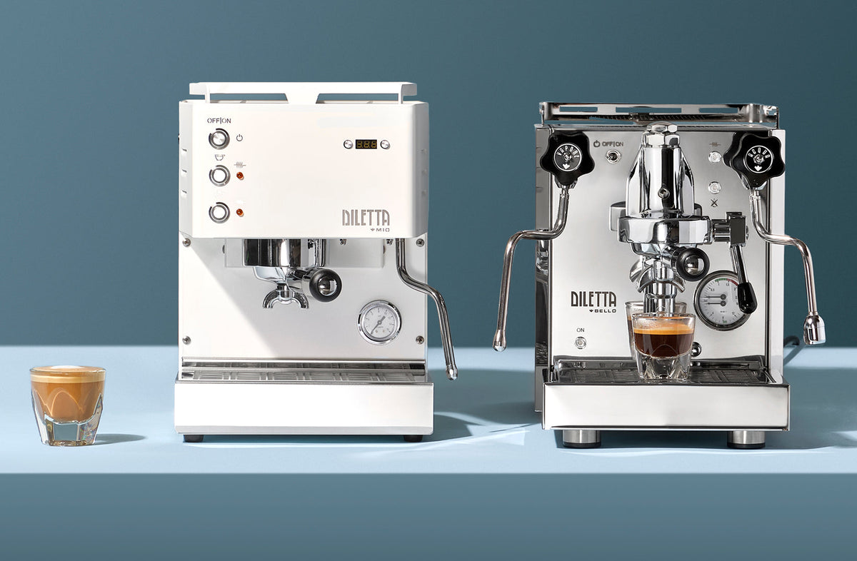White Diletta Mio beside a stainless steel Diletta Bello+ espresso machine