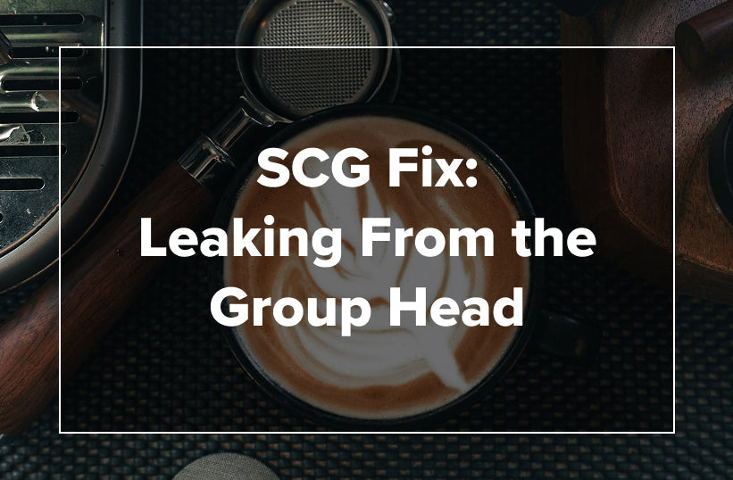 An overhead shot of a latte with group head components visible with text reading SCG Fix: Leaking From the Group Head