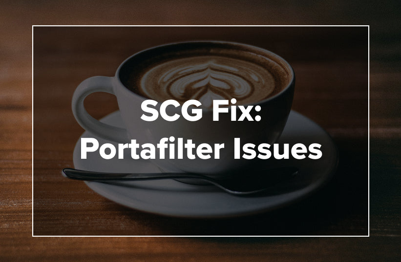 A latte in a dark cup on a saucer with text reading SCG Fix: Portafilter Issues