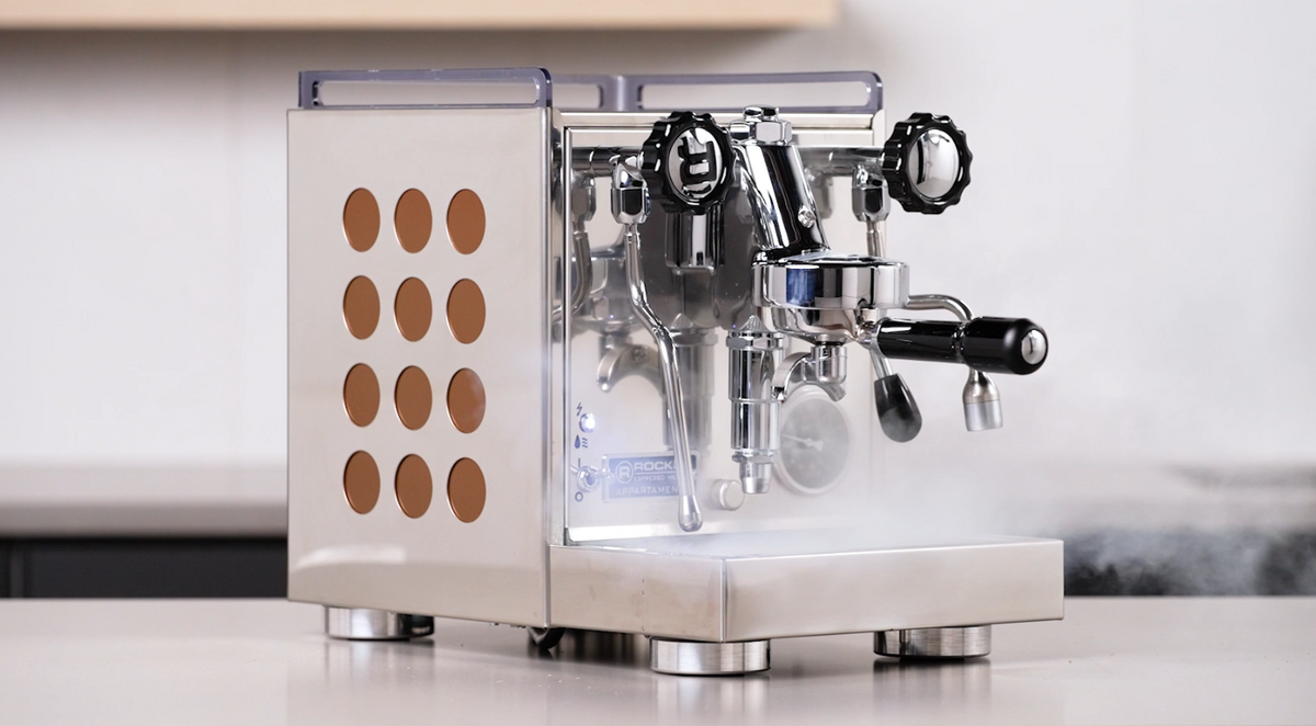Rocket Espresso Appartamento espresso machine in stainless steel with copper side panel cutouts on a kitchen countertop - Seattle Coffee Gear